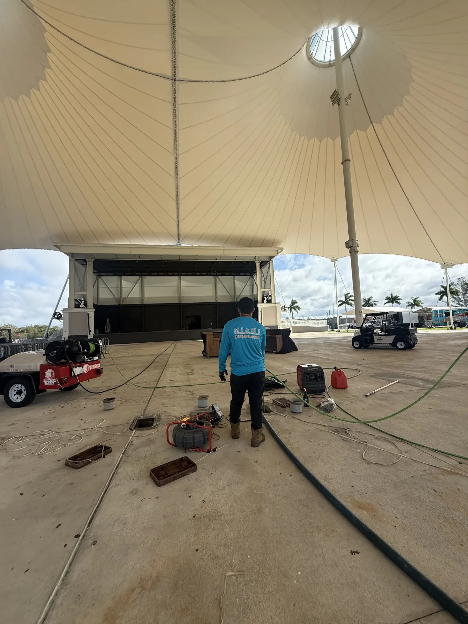 Miami Trenchless technician and sewer inspection equipment at a large commercial property